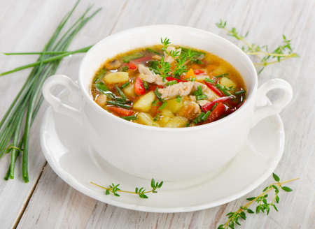 Chicken soup with vegetables with fresh herbsの写真素材