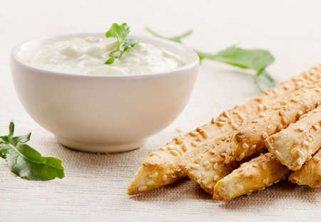 Bread sticks with sauce . Selective focus