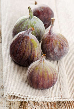 fresh figs on a wooden table. Selective focusの写真素材