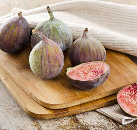 fresh figs on a wooden table. Selective focusの写真素材