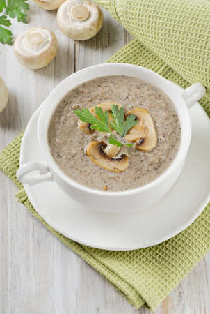 Creamy mushroom soup with fresh herbs. Selective focusの写真素材
