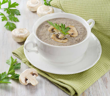 Creamy mushroom soup with fresh herbs. Selective focusの写真素材