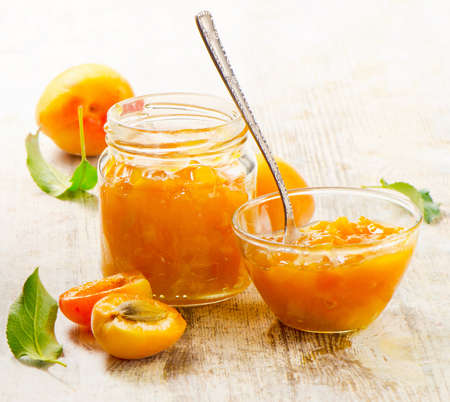 Apricots jam on a wooden table. Selective focusの写真素材