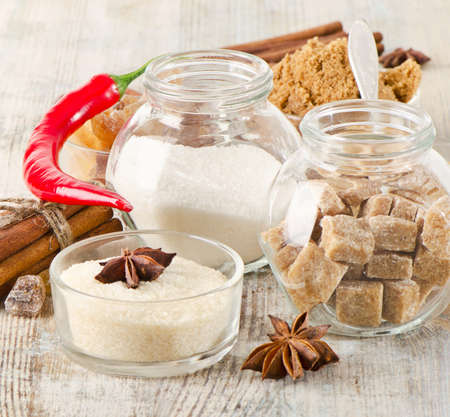 Sugar and spices on a wooden table. Selective focusの写真素材