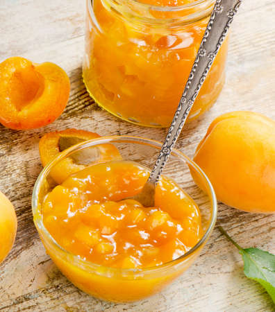 Apricots jam on a wooden table. Selective focusの写真素材