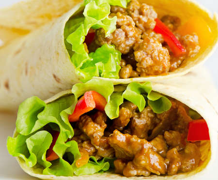 Fresh tortilla wraps with meat and vegetablesの写真素材