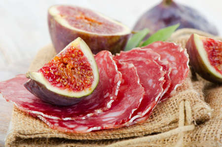 Salami and figs . Selective focusの写真素材