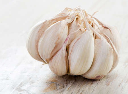 Garlic on a wooden table. Selective focusの写真素材