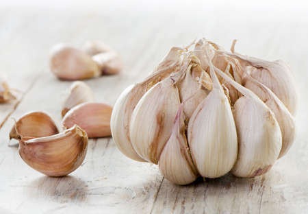 Garlic on a wooden table. Selective focusの写真素材