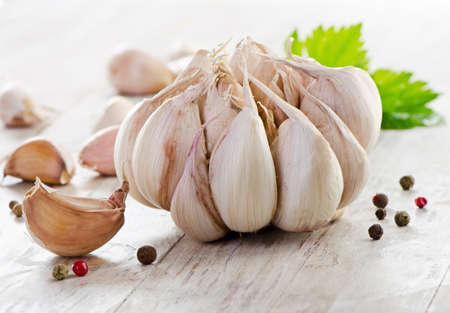 Garlic on a wooden table. Selective focusの写真素材