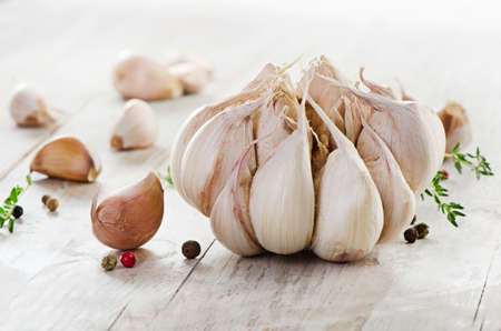 Garlic on a wooden table. Selective focusの写真素材