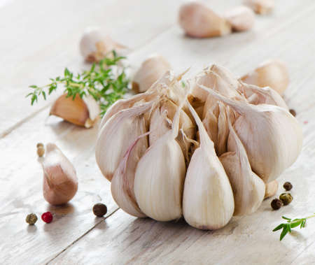Garlic on a wooden table. Selective focusの写真素材