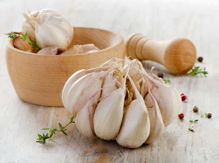 Garlic on a wooden table. Selective focusの写真素材