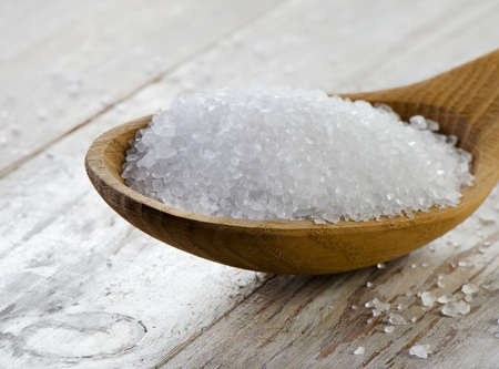 Sea salt in  wooden spoon Selective focus の写真素材