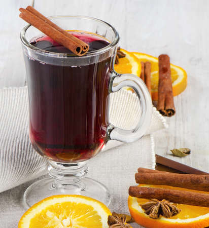 mulled wine with spices  on  wooden tableの写真素材
