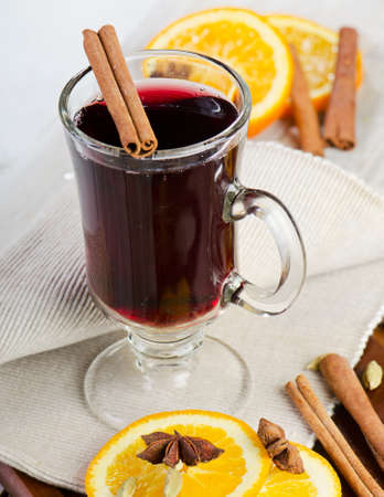 mulled wine with spices  on  wooden tableの写真素材