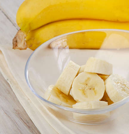 Fresh bananas on wooden background Selective focusの写真素材