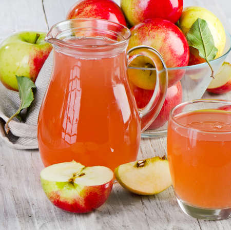 Apple juice and apples on wooden table  Selective focusの写真素材