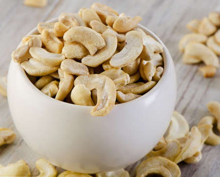Cashew nuts  on wooden table. Selective focusの写真素材