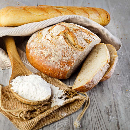 Bread on wooden table. Selective focusの写真素材