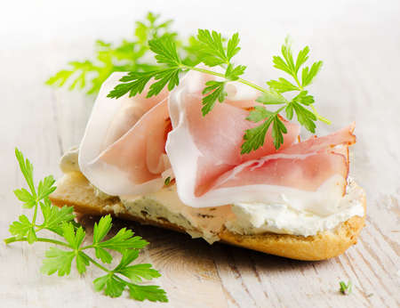 Bread with smoked bacon and cream cheese . Selective focusの写真素材