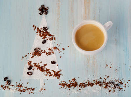 Christmas coffee and   sweet christmas tree  on wooden backgroundの写真素材