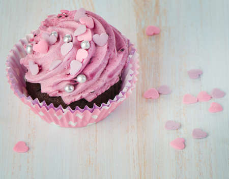 Cupcake on wooden table. Selective focusの写真素材