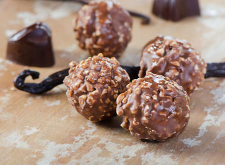 Chocolates on wooden table. Selective focusの写真素材
