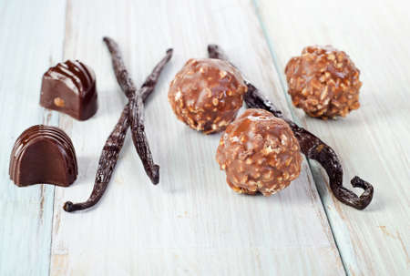 Chocolates on wooden table. Selective focusの写真素材