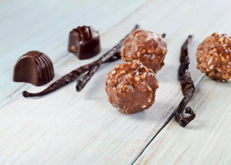 Chocolates on wooden table. Selective focusの写真素材
