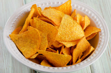 Corn chips  on wooden tableの写真素材