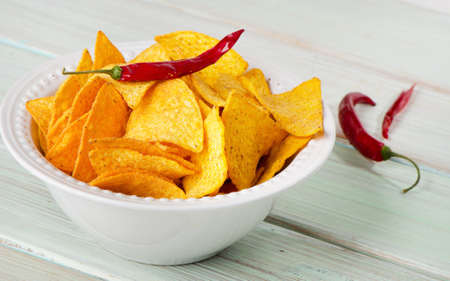 Corn chips  on wooden tableの写真素材