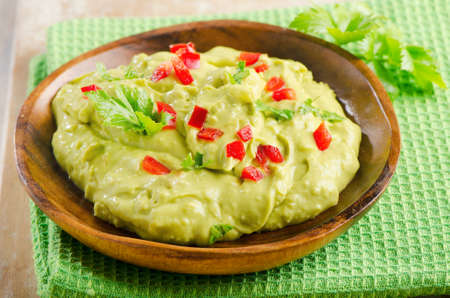 Guacamole on wooden tableの写真素材