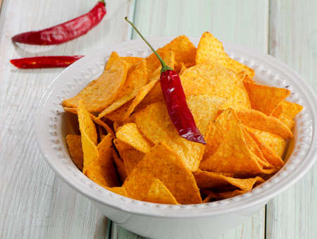 Corn chips  on wooden tableの写真素材
