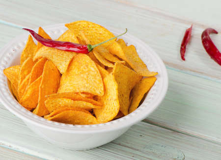 Corn chips  on wooden tableの写真素材