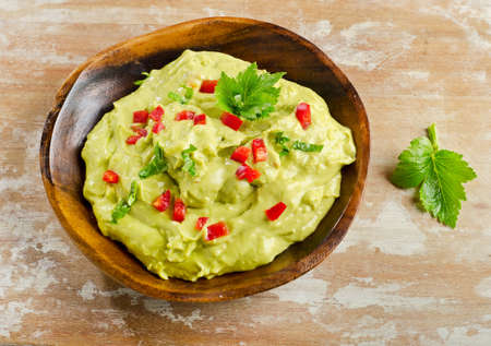 Guacamole on wooden tableの写真素材