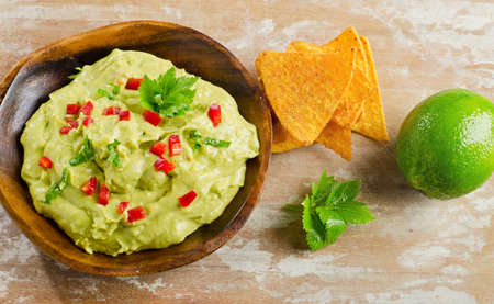 Guacamole on wooden tableの写真素材