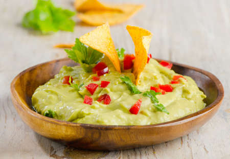 Guacamole on wooden tableの写真素材