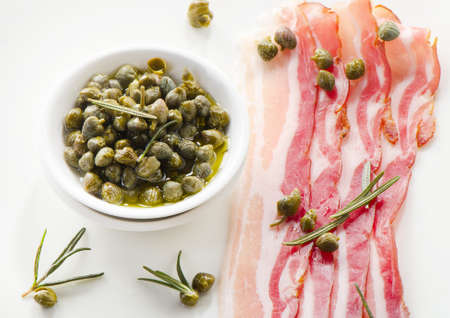 Capers and bacon slicesの写真素材