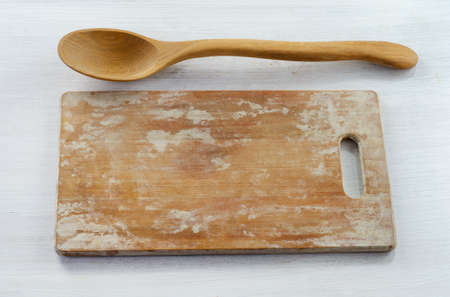 wooden spoon on cutting boardの写真素材