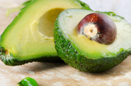 Avocado on a wooden table.Selective focus