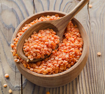 lentils on a wooden table . selective focusの写真素材