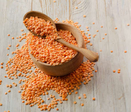 lentils on a wooden table . selective focusの写真素材
