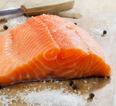 Salmon on a wooden plate . Selective focusの写真素材