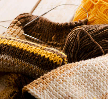 Knitting needles and Knitted wool   Selective focus