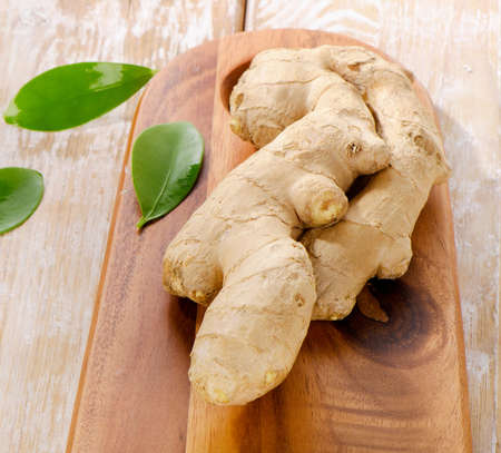 Ginger  on a wooden table. Selective focus