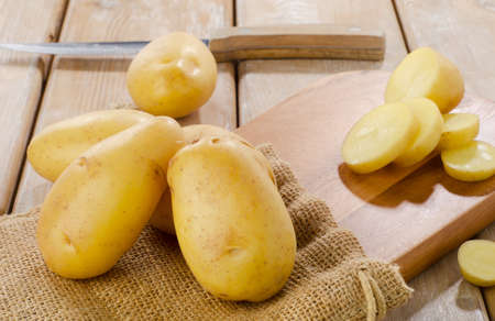 New potatoes on a wooden table. Selective focusの写真素材