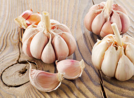 Garlic on a wooden table. Selective focusの写真素材