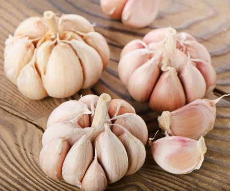 Garlic on a wooden table. Selective focusの写真素材