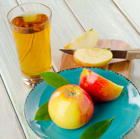 Apple juice and apples on wooden table. Selective focusの写真素材